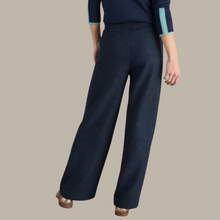 Load image into Gallery viewer, female model wearing whitestuff trousers in navy colour with arms down by side 
