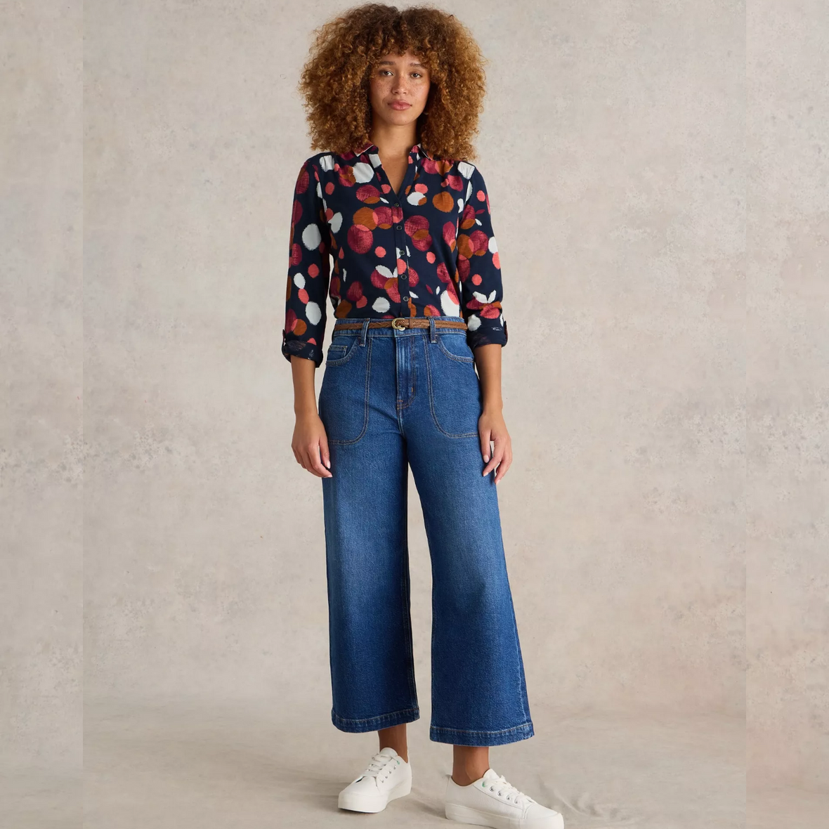 Female model wearing whitestuff shirt in plum print