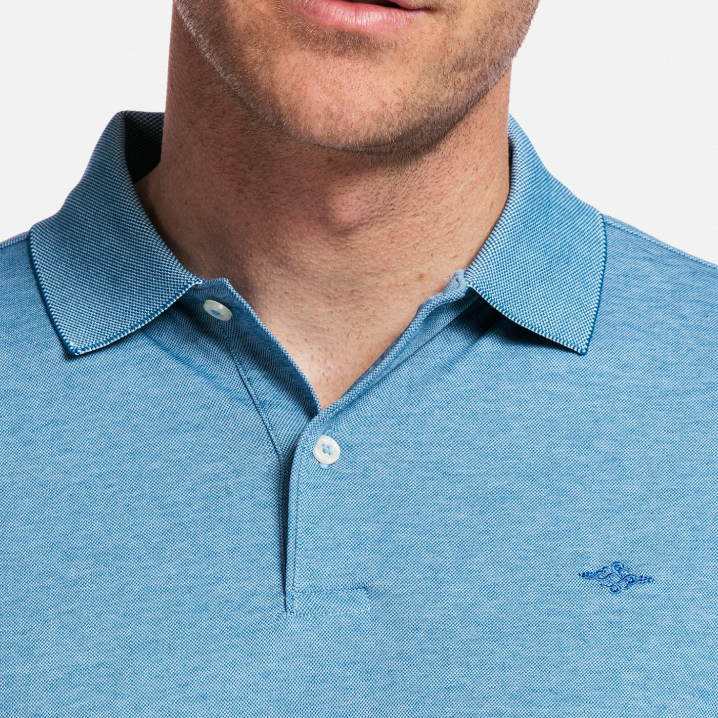 Button Detail of Polo Shirt on Model 