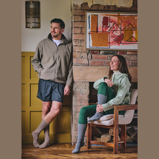 Lifestyle image of man and woman wearing socks