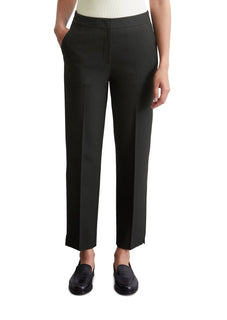 female model with hand in pocket wearing marco polo trousers in black colour