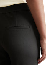 Load image into Gallery viewer, female model wearing marco polo trousers in black colour closeup
