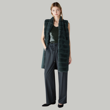 Load image into Gallery viewer, Female model with hand in pocket wearing marella paddedgilet in green 
