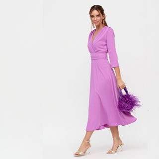 Model wearing a mauve warp around elegant dress by Rolemode