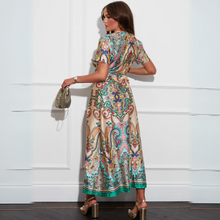 Load image into Gallery viewer, female model wearing girl in mind maxi dress in multicolour looking away from camera
