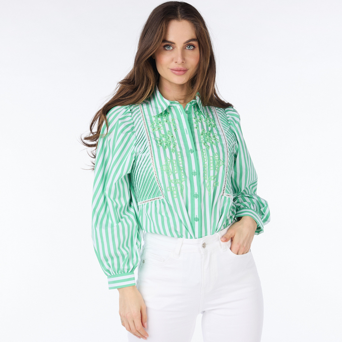 female model wearing esqualo striped blouse with hand in pocket looking at camera