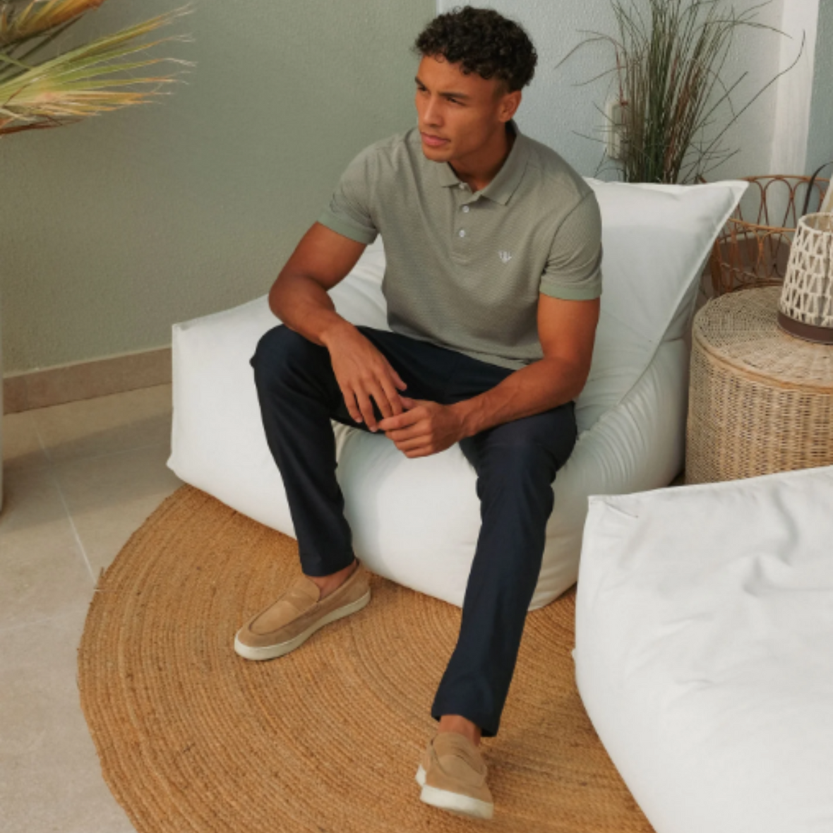 Model Seated in Polo Shirt